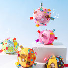 Colorful embroidered squeaky ball pet toys with animal designs, featuring polka dots and tags, perfect for playful pets.