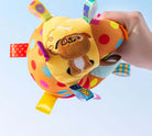 Colorful polka dot squeaky ball pet toy with embroidered dog design and ribbon tags, perfect for playful pets. Durable, interactive, and fun.