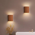 Modern Nordic LED wall lamps with ribbed design, illuminating a bedroom or living room. Stylish interior lighting, perfect for contemporary decor.