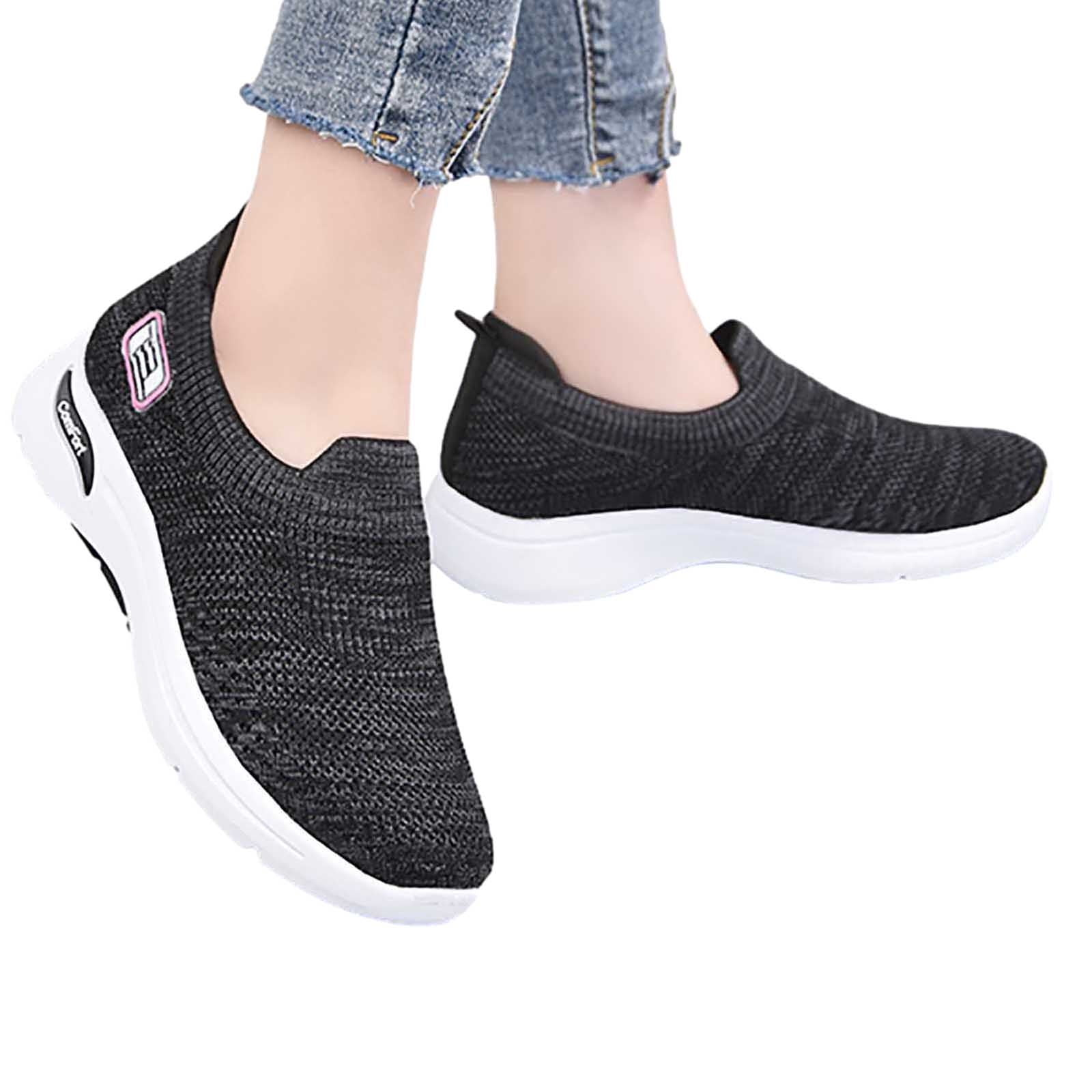 Women's black slip-on sneakers with white soles, featuring a breathable knit design. Perfect for casual wear, comfort, and style.