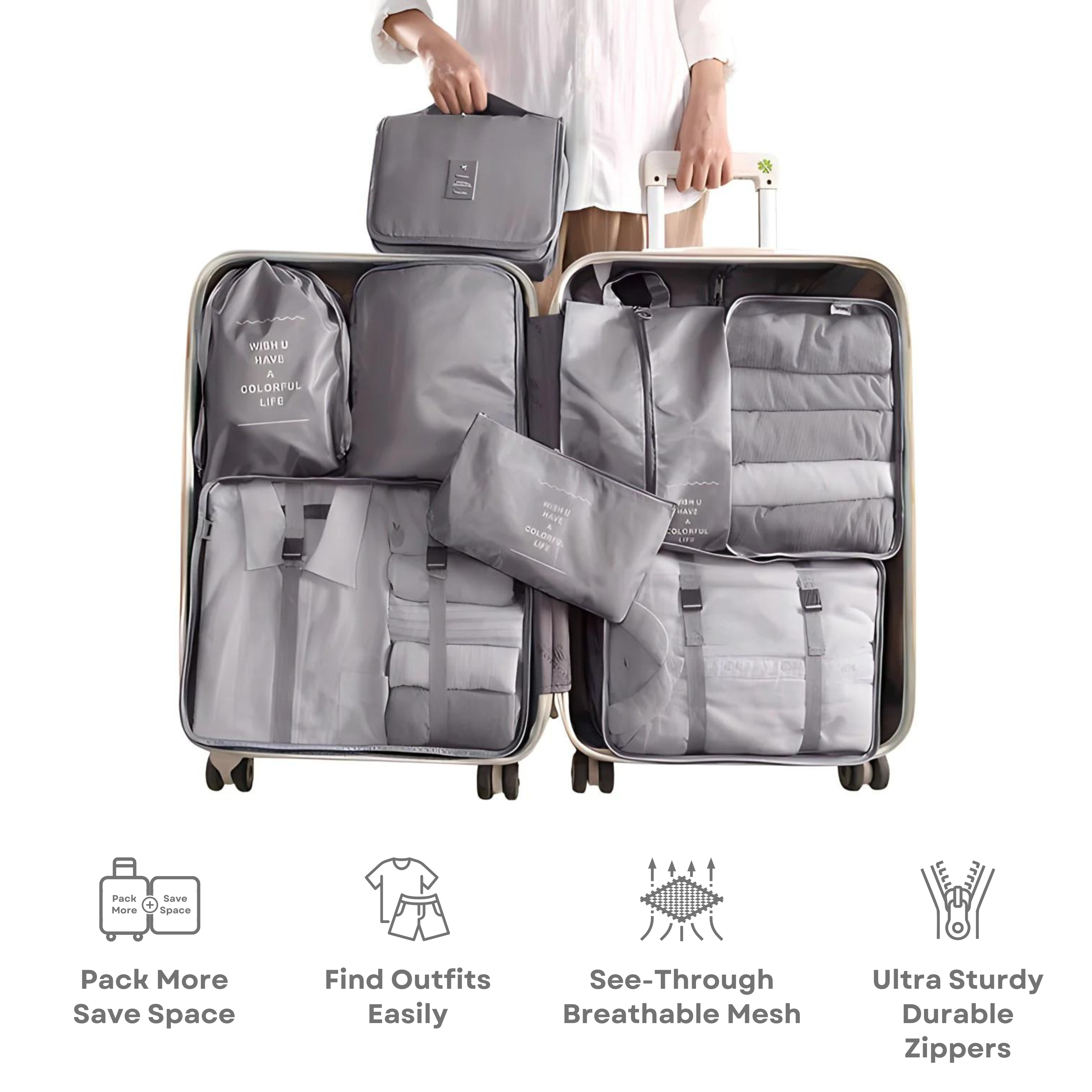 Person holding open suitcase with organized gray packing cubes, featuring see-through mesh and durable zippers. Ideal for efficient travel packing.