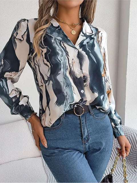 Elegant tie-dye women's shirt with autumn puff long sleeves, featuring a stylish abstract pattern. Perfect for casual wear. Fashionable and trendy.