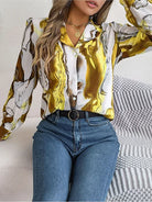 Elegant tie-dye women's shirt with autumn puff long sleeves, featuring a vibrant yellow and brown pattern. Perfect for casual and stylish outfits.