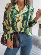 Elegant tie-dye women's shirt with autumn puff long sleeves, featuring a green and yellow marble pattern. Perfect for casual fashion and style.