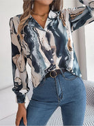 Elegant tie-dye women's shirt with autumn puff long sleeves, featuring a stylish abstract pattern. Perfect for casual wear.