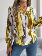 Elegant tie-dye women's shirt with autumn puff long sleeves, featuring a vibrant yellow and brown pattern. Perfect for casual and stylish outfits.