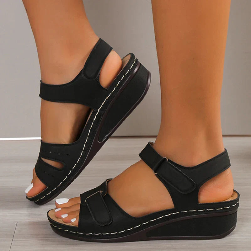 Women's black open-toe wedge sandals with buckle, elegant summer fashion footwear, plus size available, stylish and comfortable design.