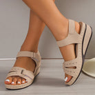 Women's beige open-toe sandals with buckle, elegant plus size summer shoes, featuring a comfortable wedge heel and stylish design.