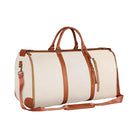 Stylish beige and brown leather weekender duffle bag with adjustable shoulder strap, perfect for travel and overnight trips. Durable and spacious design.