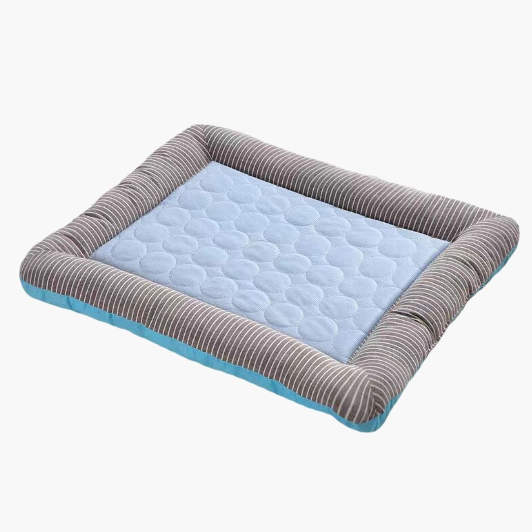 Blue and gray striped pet cooling mat with quilted design, ideal for dogs and cats. Breathable, comfortable, and perfect for hot weather relief.