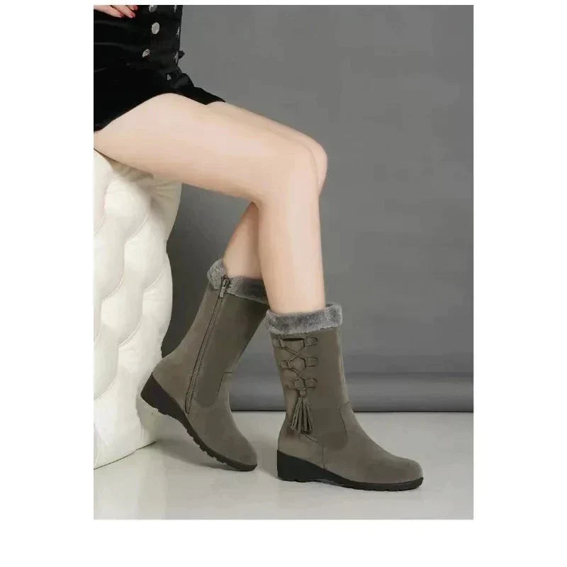 Women's mid-calf snow boots with mid heels, zipper, and plush lining. Stylish winter footwear, suede material, trendy design, perfect for cold weather.