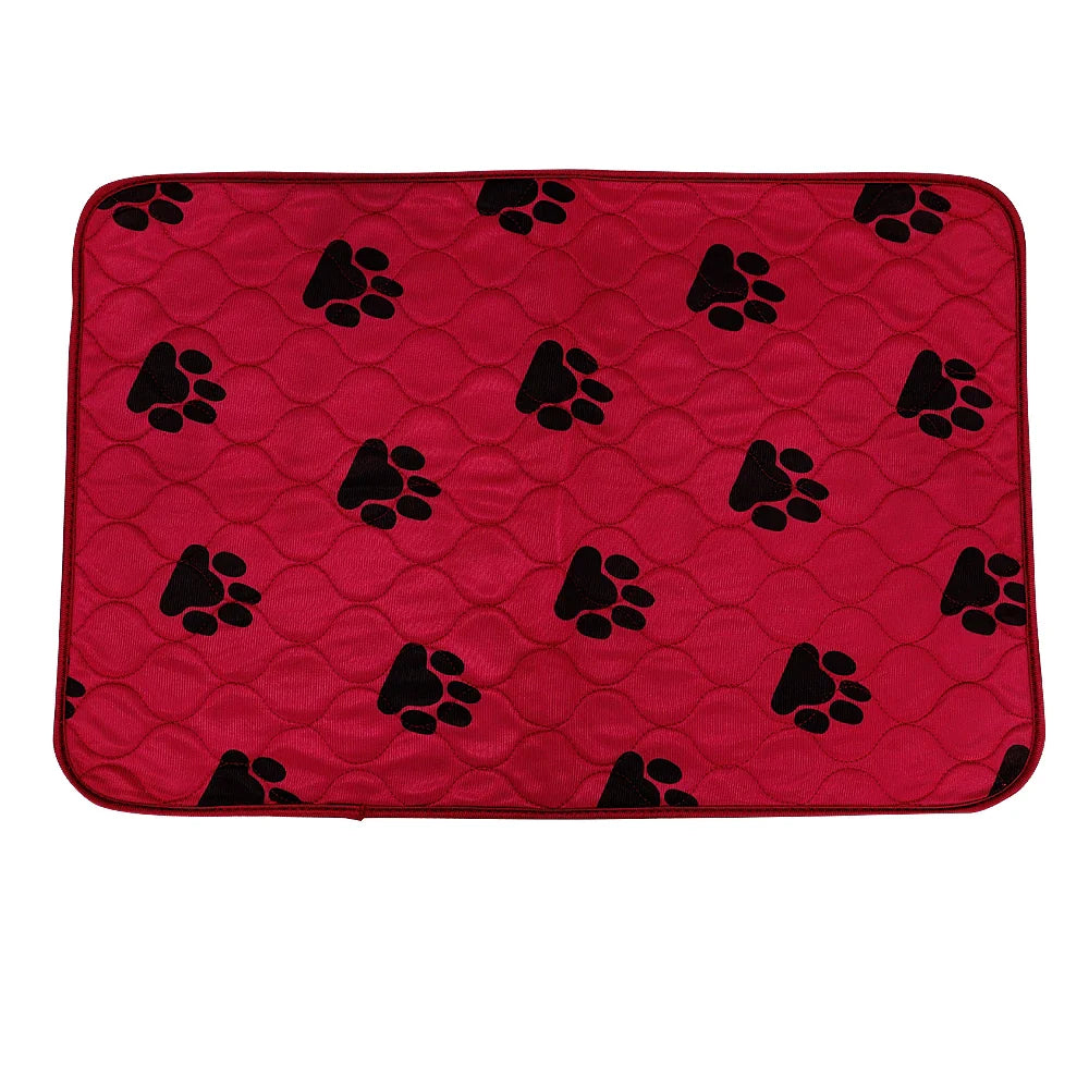 Red quilted pet mat with black paw print design, durable and washable, ideal for dogs and cats.