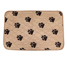 Beige quilted pet mat with black paw print design, waterproof, non-slip, for dogs and cats.