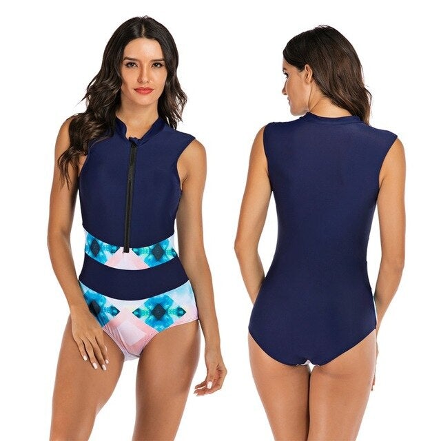 Women's navy blue sleeveless swimsuit with front zipper and geometric waistband. Stylish swimwear for beach and pool. Fashionable one-piece bathing suit.