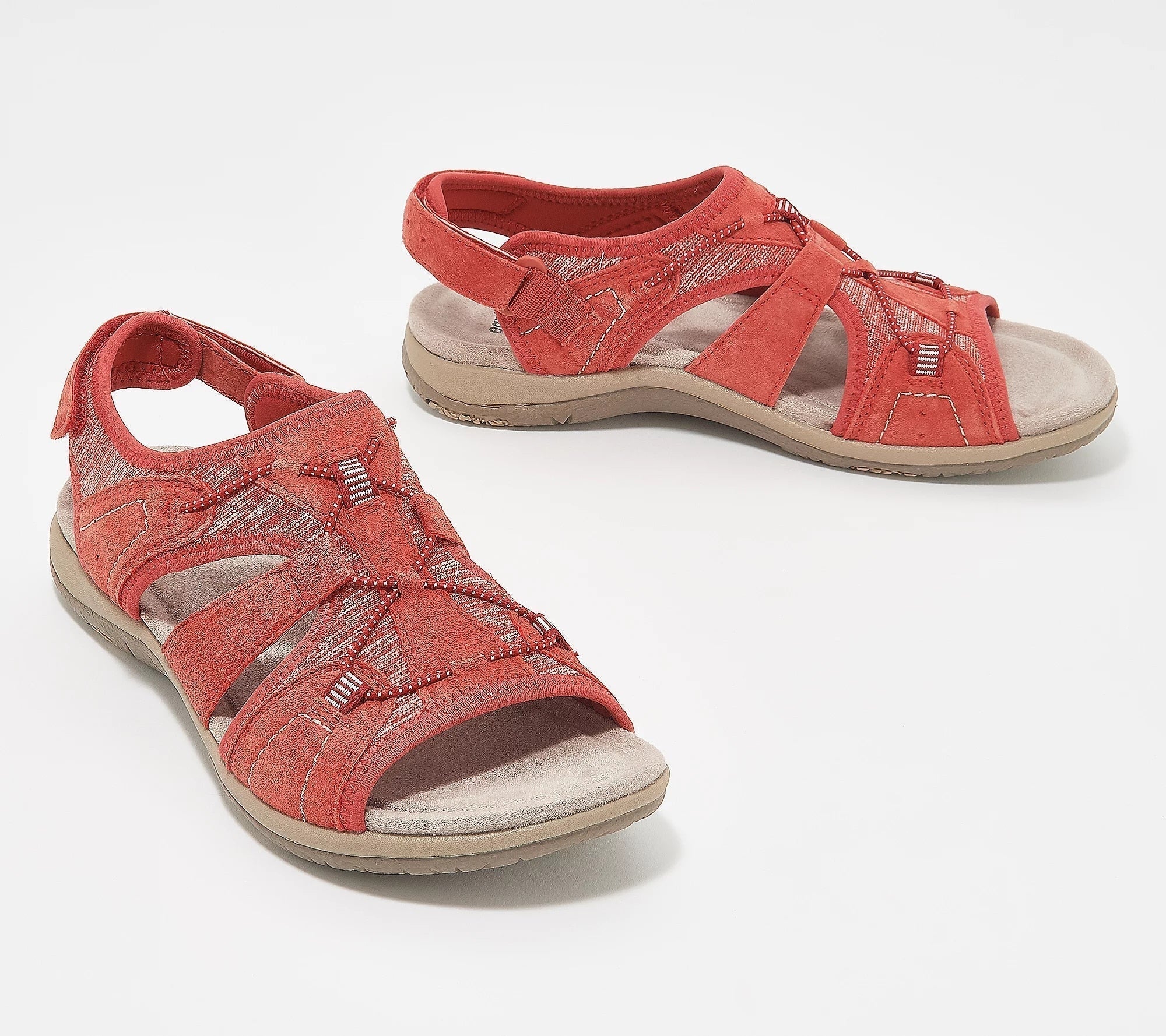 Red women's strappy sandals with cushioned soles, adjustable straps, and decorative stitching. Perfect for casual summer wear and outdoor activities.