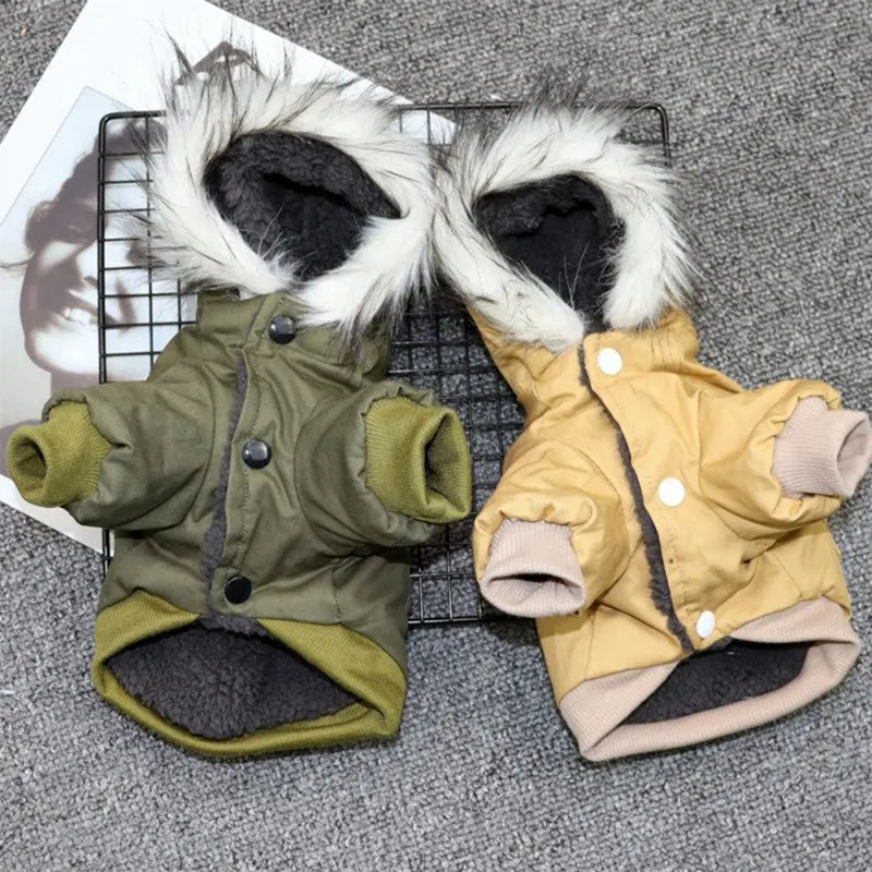 Two stylish dog winter coats with faux fur hoods, one in olive green and the other in beige, displayed on a gray textured background.