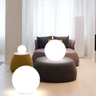 Modern living room with Homora Glimmer Sphere LED lights; stylish decor featuring glowing orbs, contemporary furniture, and soft lighting ambiance.