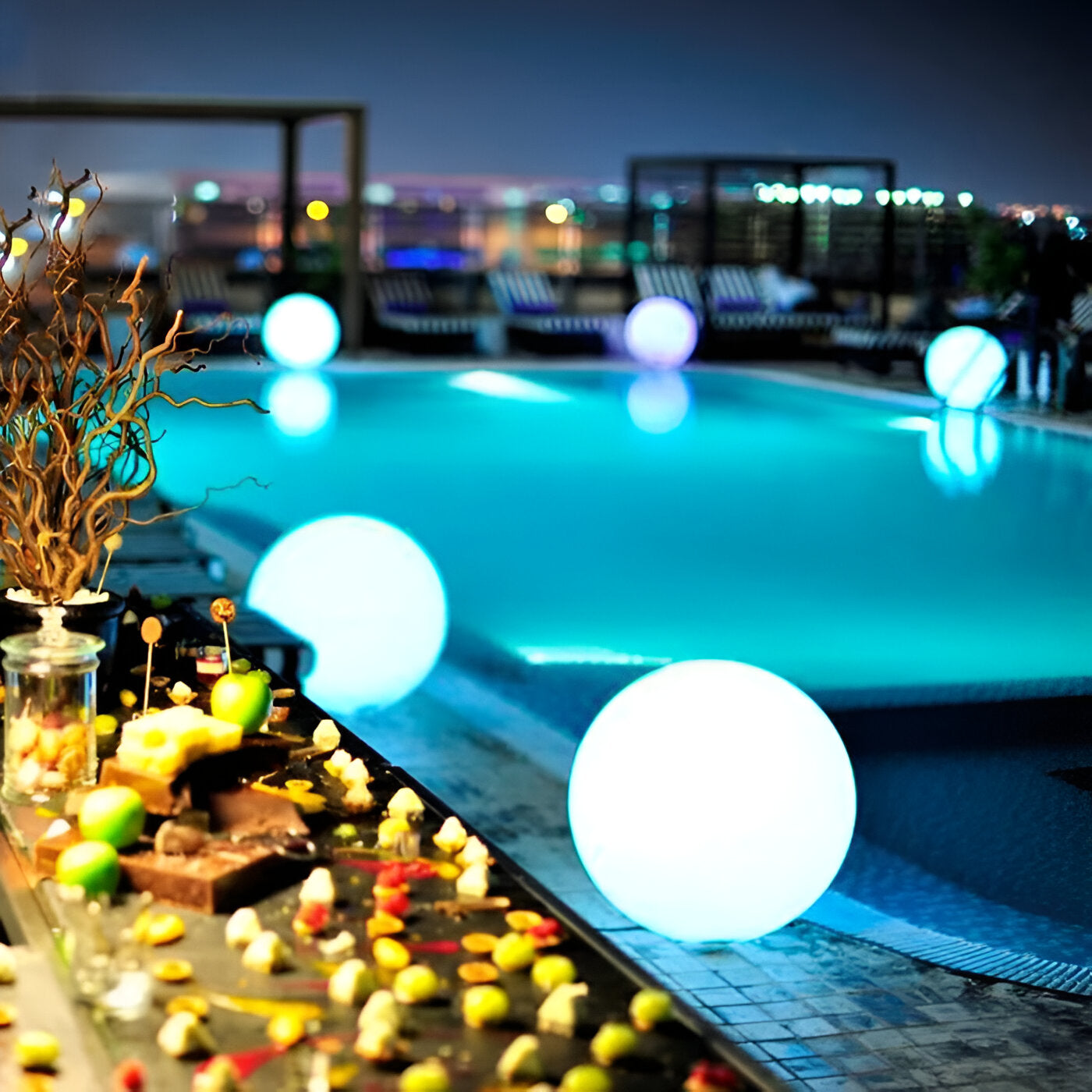 LED Glowing Spheres by Poolside at Night, Outdoor Decor, Modern Ambiance, Illuminated Garden Orbs, Stylish Patio Lighting, Nighttime Pool Party.