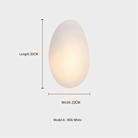 Egg-shaped wall light, Model A in Milk White, 35cm length, 22cm width. Modern home decor, ambient lighting, minimalist design.