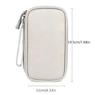 White leather travel wallet with zipper, wrist strap, and dimensions 19.5cm x 11cm. Ideal for organizing essentials. Stylish and compact design.