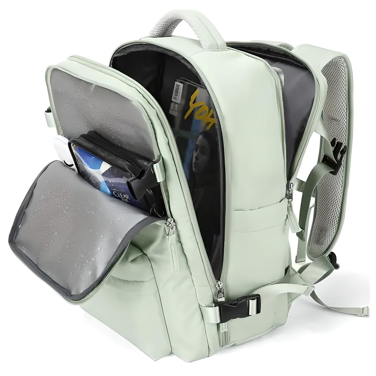 Light green waterproof backpack with multiple compartments, open to reveal a magazine and tech gadgets. Ideal for travel, school, or work organization.