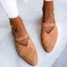 Women's woven leather slip-on flats, tan color, stylish and comfortable, perfect for casual wear. Fashionable footwear for women.