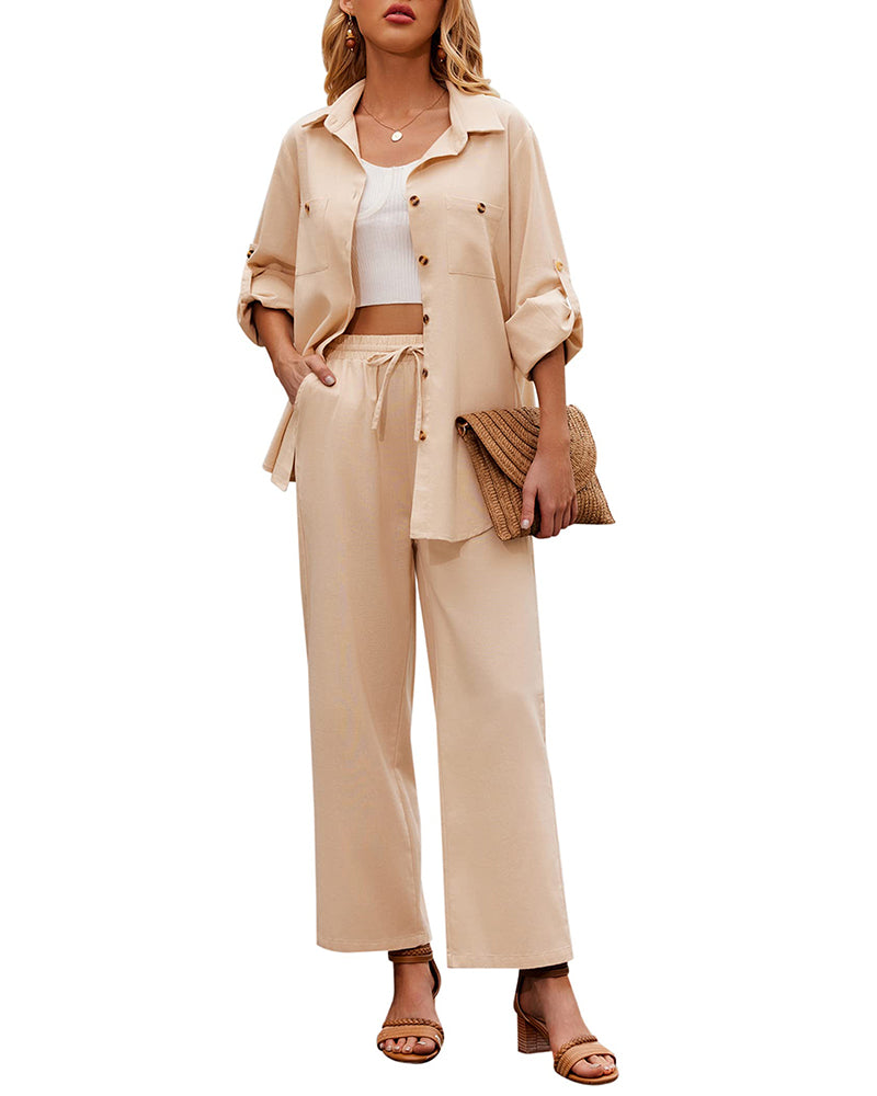 Woman in stylish khaki two-piece outfit with button-up shirt and wide-leg pants, holding a woven clutch. Fashionable casual wear for women.