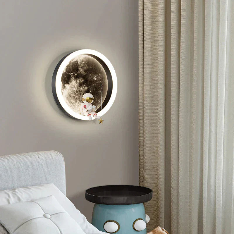 LED moon wall lamp with cartoon astronaut design, perfect for children's room or bedroom decor. Modern wall sconce with soft ambient lighting.