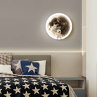 LED moon wall lamp with cartoon astronaut design, perfect for children's room or bedroom decor. Modern wall sconce with star-themed bedding.