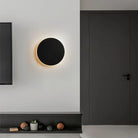 Modern round LED wall lamp with touch switch, minimalist design, illuminating a sleek interior space. Ideal for bedroom, stair, or porch lighting.