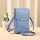 Blue ladies shoulder bag with adjustable strap, sleek design, and multiple compartments. Perfect for fashion-forward women. Ideal for casual outings.