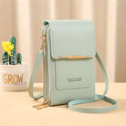 Mint green ladies shoulder bag with gold zippers, adjustable strap, and front pocket. Stylish crossbody purse for women. Fashionable accessory.