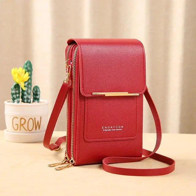 Red ladies shoulder bag with gold zipper and strap, featuring a sleek design. Perfect for fashion-forward women. Ideal for casual and formal occasions.