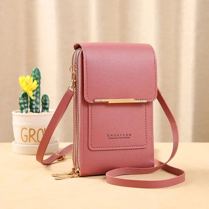 Pink ladies shoulder bag with gold accents, featuring a sleek design and adjustable strap. Perfect for fashion-forward women seeking style and functionality.