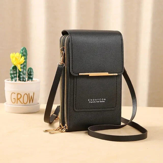 Black ladies shoulder bag with gold zipper, sleek design, and adjustable strap. Perfect for fashion-forward women. Ideal for casual or formal use.