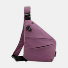 Magenta crossbody sling bag with adjustable strap, modern design, and secure buckle. Ideal for travel and daily use. Stylish and functional accessory.