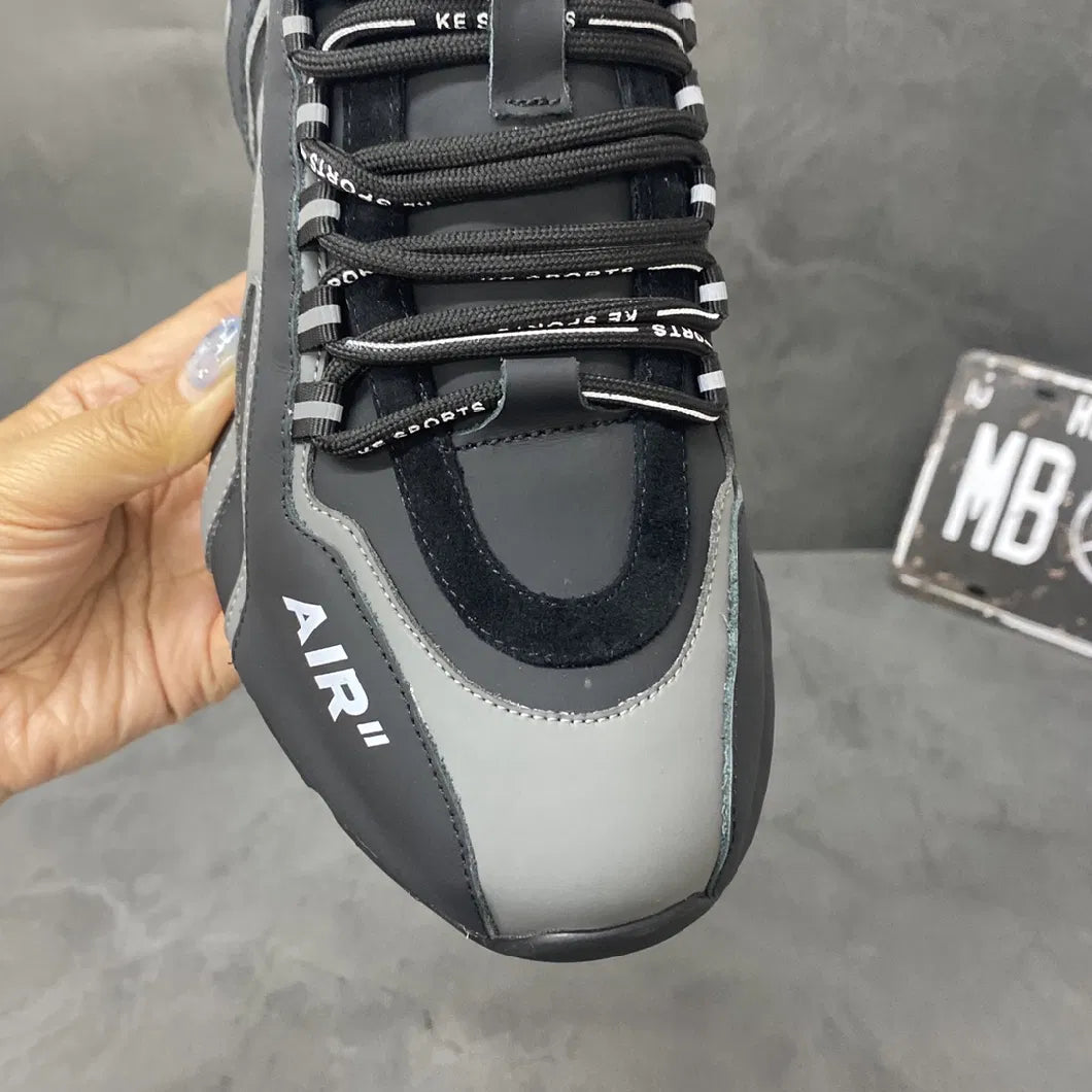 Men's running sneakers with air cushion, featuring black and gray design, durable laces, and sleek athletic style. Perfect for tennis and basketball.