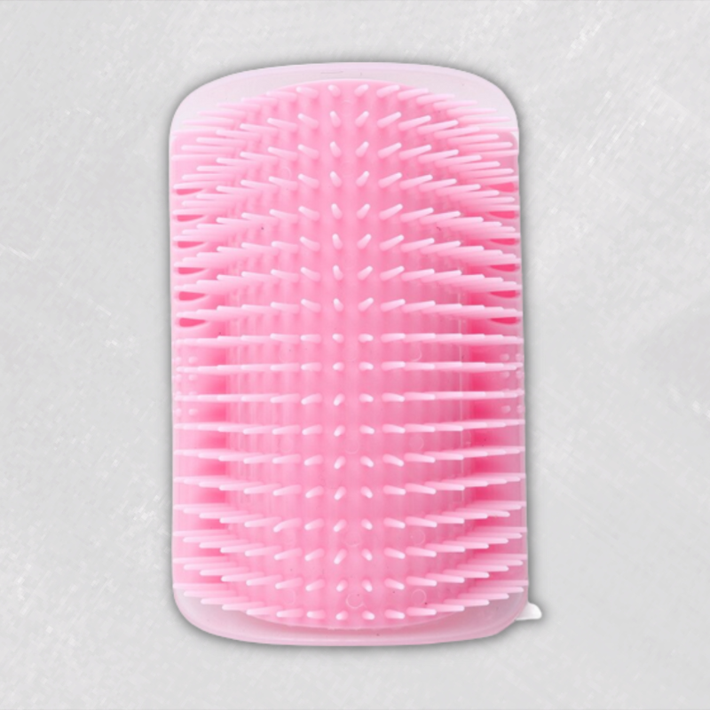 Pink cat wall brush with soft bristles for grooming and massaging, practical pet accessory.