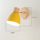 Yellow Nordic wall lamp with wooden base, ideal for bedroom or living room. Modern E27 sconce design, perfect for home lighting. Dimensions: 20.5x14x10cm.