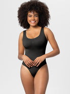 Black sleeveless bodysuit on smiling woman, showcasing comfortable, stylish fit. Perfect for casual wear or layering. Fashionable women's clothing.
