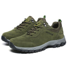 Olive green outdoor hiking shoes with durable rubber soles, lace-up design, and breathable mesh lining, ideal for trekking and adventure activities.