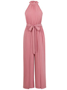 Pink halter neck jumpsuit with tie waist, sleeveless design, and wide-leg pants. Perfect for summer fashion, women's trendy clothing, elegant style.