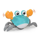 Toy crab with blue shell, orange claws, and googly eyes. Interactive crawling crab toy for kids. Fun, educational, battery-operated toy.