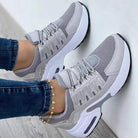 Gray orthopedic comfort sneakers for women, featuring breathable mesh, cushioned soles, and stylish design. Ideal for casual wear and foot support.