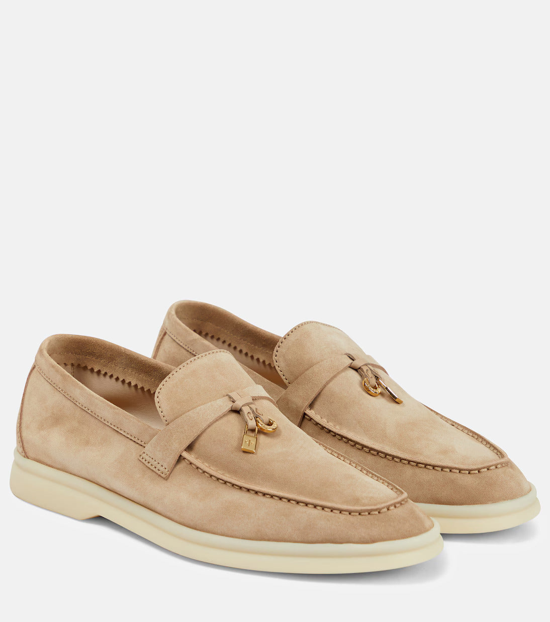 Beige suede loafers with tassel detail, featuring a sleek design and comfortable sole. Perfect for casual and formal wear. Men's fashion footwear.