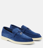 Blue suede loafers with tassel detail, featuring a sleek design and cream rubber soles. Perfect for casual and formal wear. Men's fashion footwear.