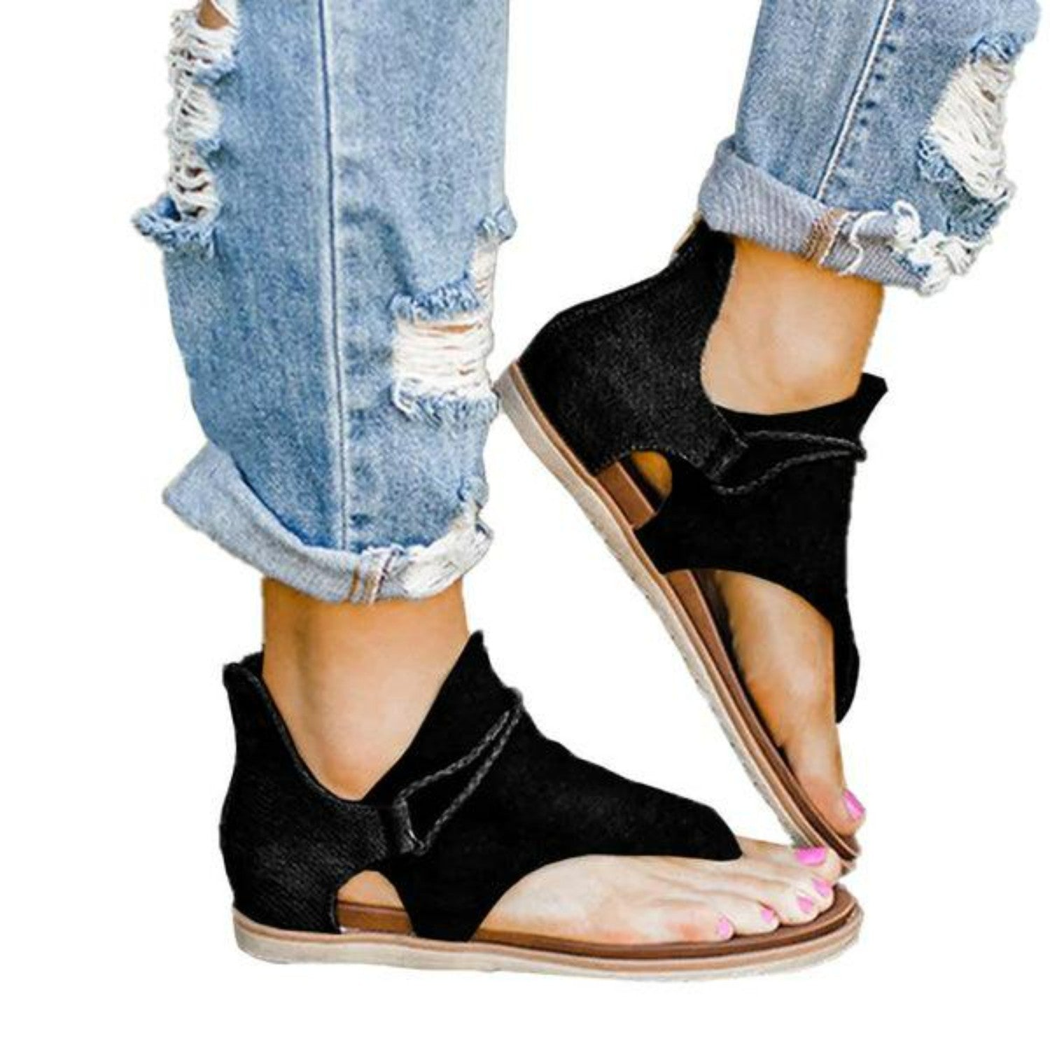 Black open-toe sandals with ankle strap, paired with distressed blue jeans. Fashionable women's footwear, casual summer style.