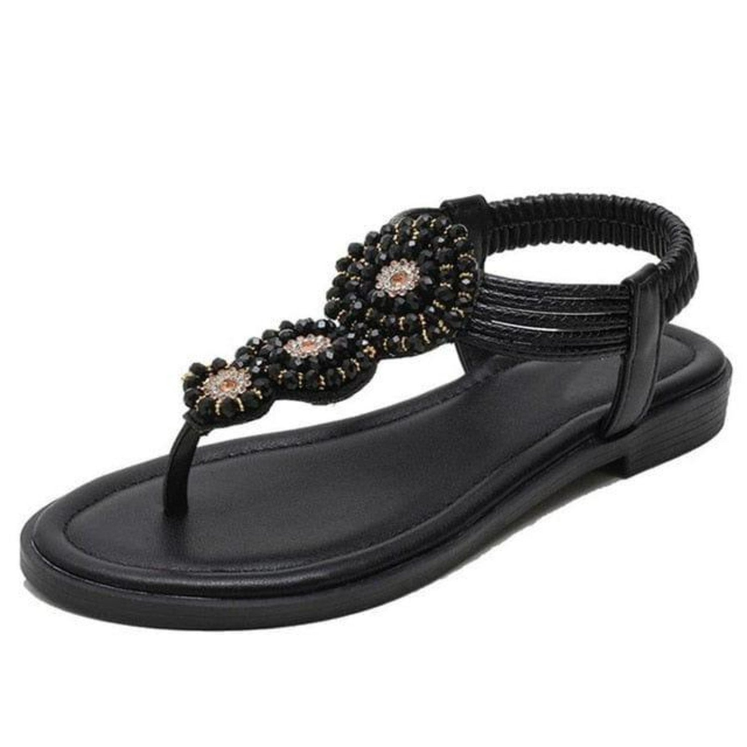 Black beaded women's sandal with floral embellishments, featuring a comfortable flat sole and elastic ankle strap. Perfect for summer fashion.