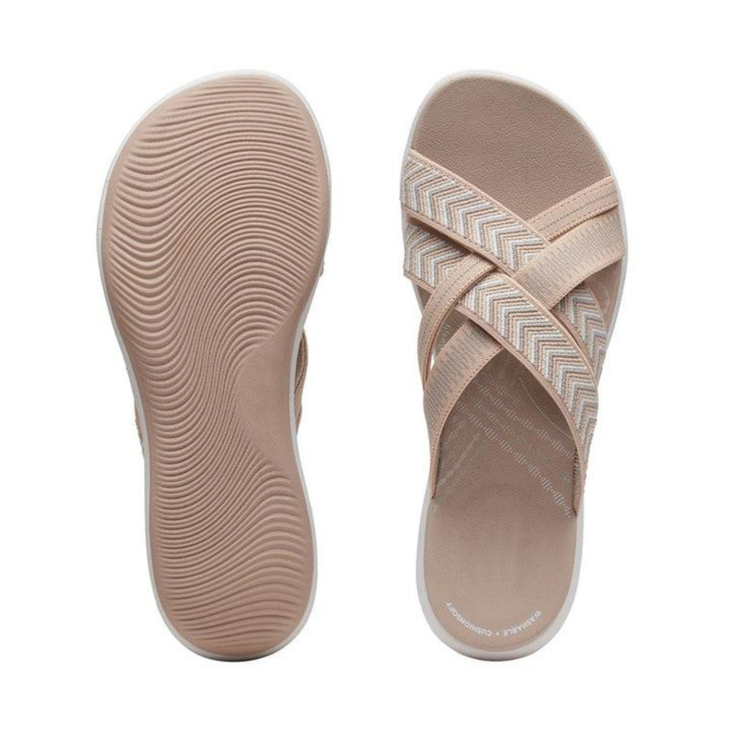 Beige women's slip-on sandals with crisscross straps and textured soles, featuring a chevron pattern. Comfortable, stylish summer footwear.