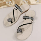 Elegant women's sandals with rhinestone embellishments, featuring a spiral strap design and cushioned sole, perfect for summer fashion and comfort.